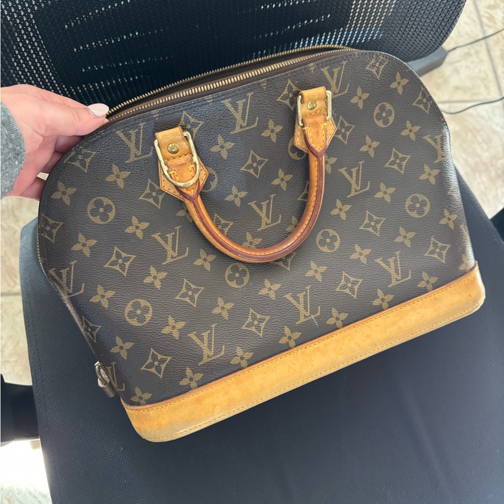 Authentic Vintage Louis Vuitton bag. No longer sold in stores.